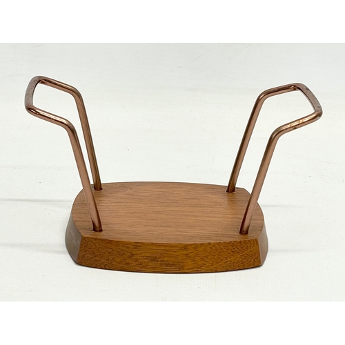 18 - A collection of Mid Century kitchenware. Teak coasters and stand, pig cocktail, double sided tray, 2... 