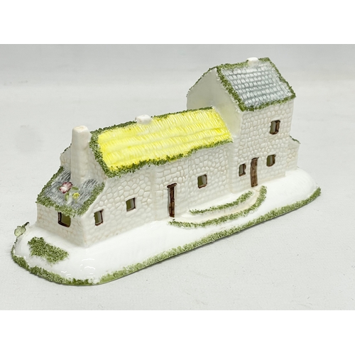 66 - A collection of Coalport pottery houses. The Farmhouse 20cm. The Master’s House 11x10.5cm. Limited E... 