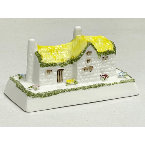 66 - A collection of Coalport pottery houses. The Farmhouse 20cm. The Master’s House 11x10.5cm. Limited E... 