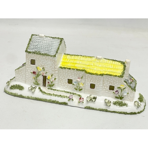 66 - A collection of Coalport pottery houses. The Farmhouse 20cm. The Master’s House 11x10.5cm. Limited E... 