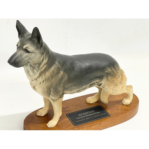 196 - A large Beswick pottery Alsatian German Shepard on stand. 28x22cm