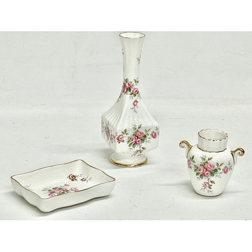 219 - A collection of Aynsley pottery. 4 pieces of Aynsley Grotto Rose and an Aynsley Orchard Gold toothpi... 