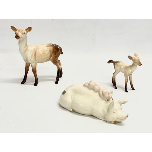 220 - A collection of Beswick pottery animals. ‘Piggy Back’ pigs 17cm. 3 deers, largest 14x15cm. A Beswick... 