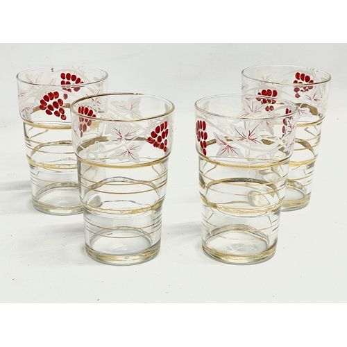 225 - A 1970’s Mid Century drinks set. 4 juice glasses and matching jug.