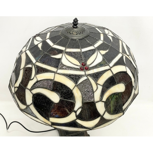 76 - A large Tiffany style table lamp. Shade measures 52x30cm. Base 48cm.