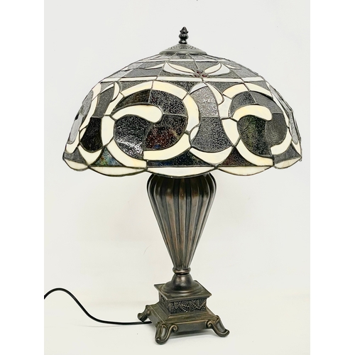 76 - A large Tiffany style table lamp. Shade measures 52x30cm. Base 48cm.