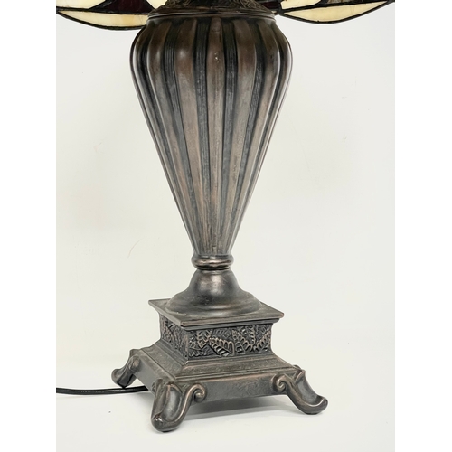 76 - A large Tiffany style table lamp. Shade measures 52x30cm. Base 48cm.