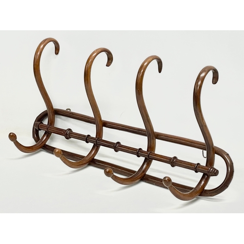 77 - An early 20th century Bentwood hat and coat rack. 73x35cm