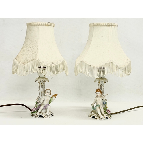 78 - A pair of Von Schierholz porcelain cherub lamps. PMP. 36cm