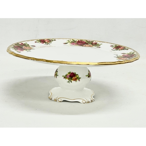 31 - A Royal Albert Old Country Roses teapot and comport cake stand. Teapot 26x19cm.