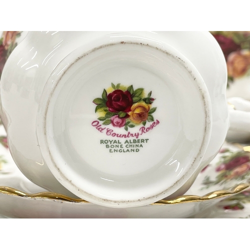 33 - An 18 piece Royal Albert ‘Old Country Roses’ tea set.  6 sandwich plates, 6 saucers, 6 cups.