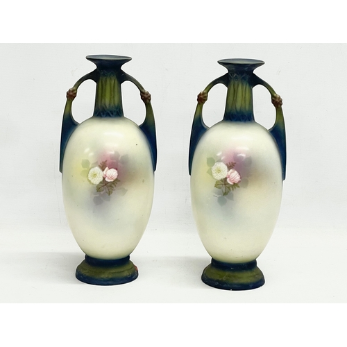 79 - A pair of Austrian hand painted porcelain vases by Robert Hanke for Royal Wettina. Circa 1900. 28cm