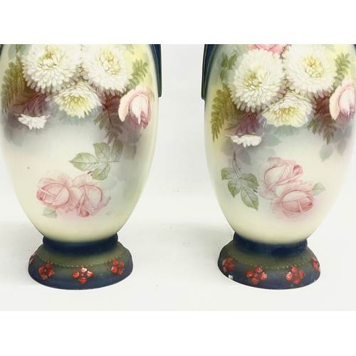 79 - A pair of Austrian hand painted porcelain vases by Robert Hanke for Royal Wettina. Circa 1900. 28cm