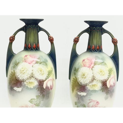 79 - A pair of Austrian hand painted porcelain vases by Robert Hanke for Royal Wettina. Circa 1900. 28cm