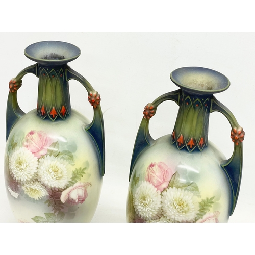 79 - A pair of Austrian hand painted porcelain vases by Robert Hanke for Royal Wettina. Circa 1900. 28cm