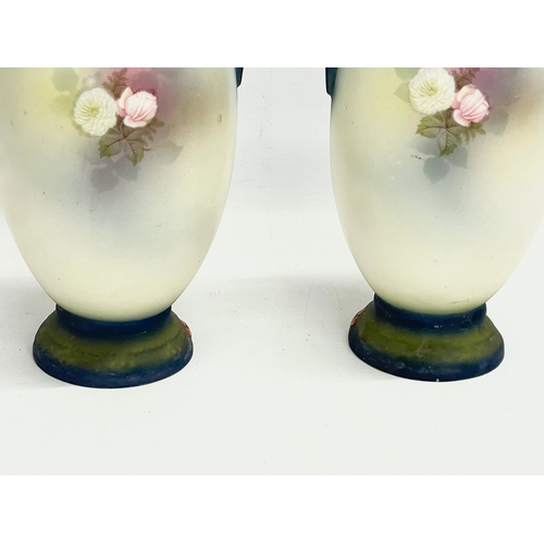 79 - A pair of Austrian hand painted porcelain vases by Robert Hanke for Royal Wettina. Circa 1900. 28cm