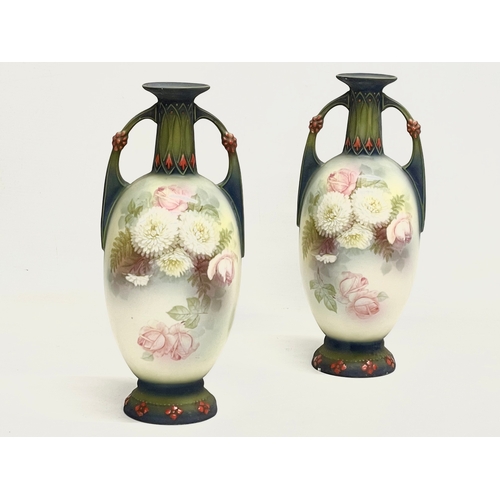 79 - A pair of Austrian hand painted porcelain vases by Robert Hanke for Royal Wettina. Circa 1900. 28cm