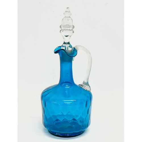 230 - A large late Victorian hand painted glass vase with a late Victorian blue glass claret jug with stop... 