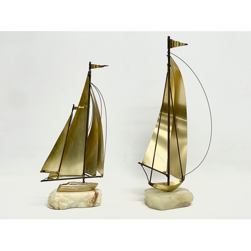 231 - 2 De Mott brass and onyx sailing yacht ornaments designed by John & Don Demott. 37cm