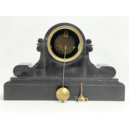 234 - A large Victorian slate mantle clock by C.J & Co. French movement. With key and pendulum.