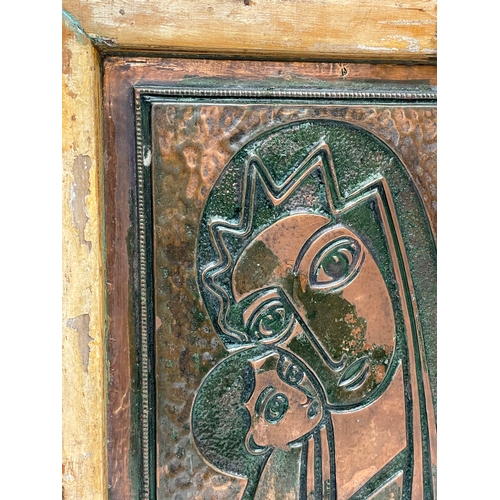 81 - An early 20th century Madonna and Child copper panel on wooden frame. 45x49cm