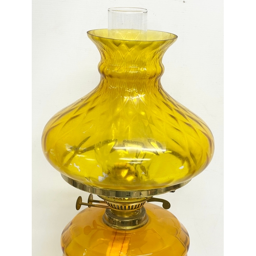 82 - A large Victorian style double burner oil lamp with Amber Glass bowl, brass Corinthian style column ... 