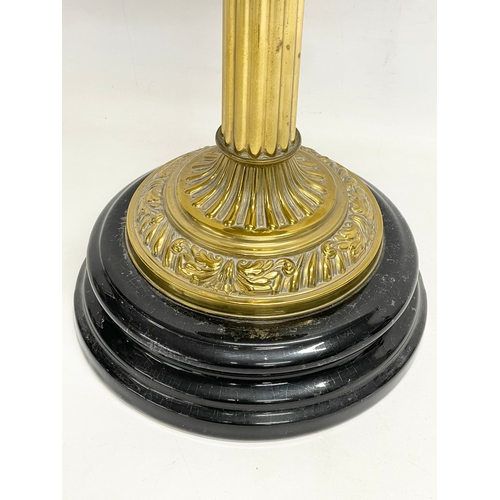 83 - A large Victorian style brass double burner oil lamp. 69cm