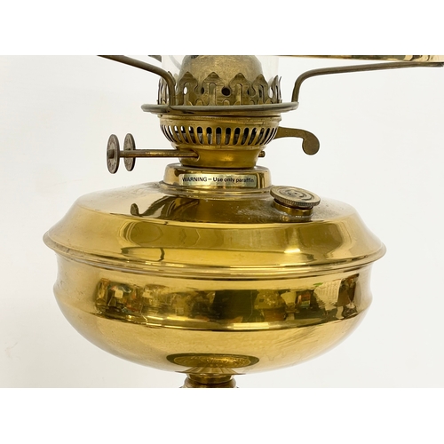 83 - A large Victorian style brass double burner oil lamp. 69cm