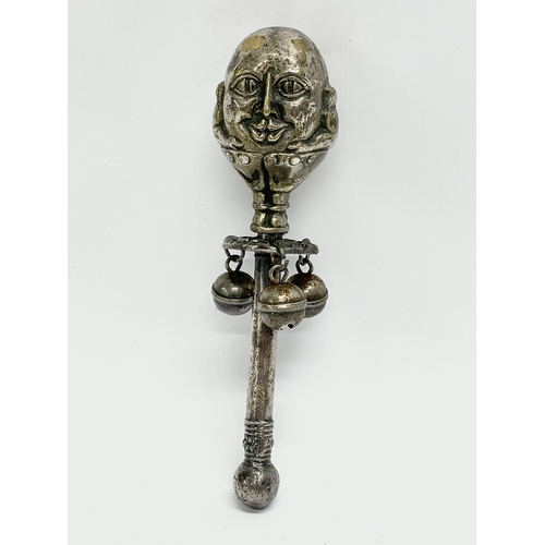 131 - A Victorian silver plated 2 faced Humpty Dumpty baby rattle. 15cm