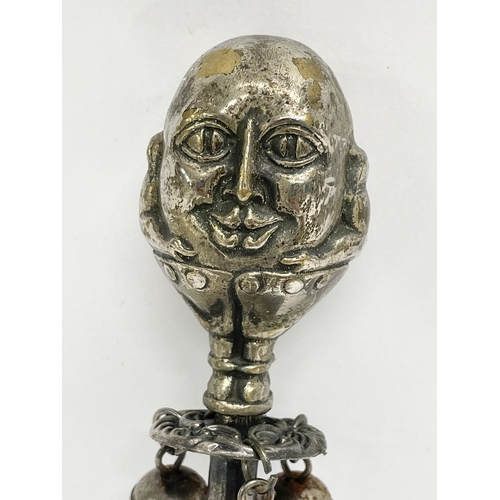 131 - A Victorian silver plated 2 faced Humpty Dumpty baby rattle. 15cm