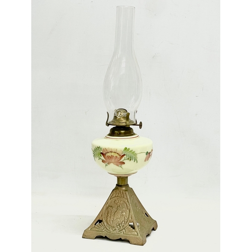 89 - An Edwardian oil lamp with hand painted glass bowl and brass base. 52cm