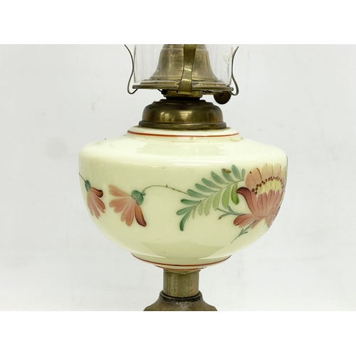 89 - An Edwardian oil lamp with hand painted glass bowl and brass base. 52cm