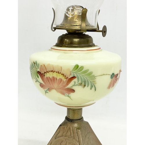 89 - An Edwardian oil lamp with hand painted glass bowl and brass base. 52cm