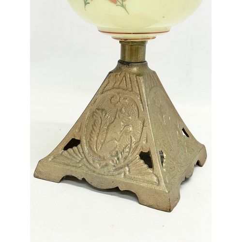 89 - An Edwardian oil lamp with hand painted glass bowl and brass base. 52cm