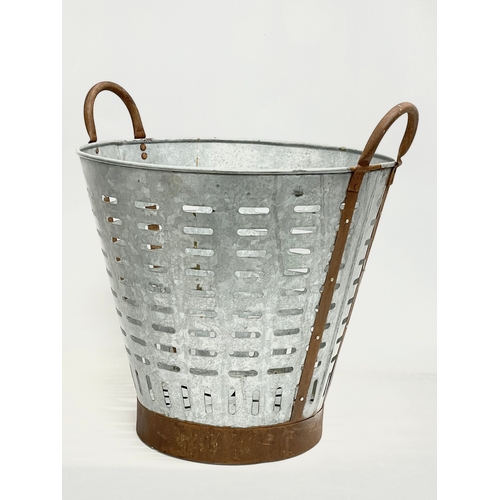 91 - A vintage French galvanised olive basket. 45x40x45cm