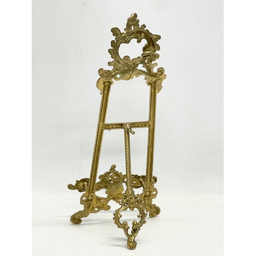 92 - 3 large 18th century style brass tabletop easels. Largest 27x55cm.