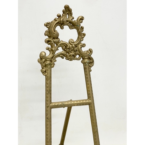 92 - 3 large 18th century style brass tabletop easels. Largest 27x55cm.