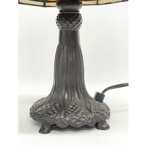 241 - A Tiffany style table lamp. 37cm