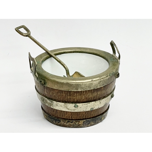 133 - A 2 piece Victorian oak and silver plated condiment set by John Grinsell & Sons. Circa 1880. 9x8cm