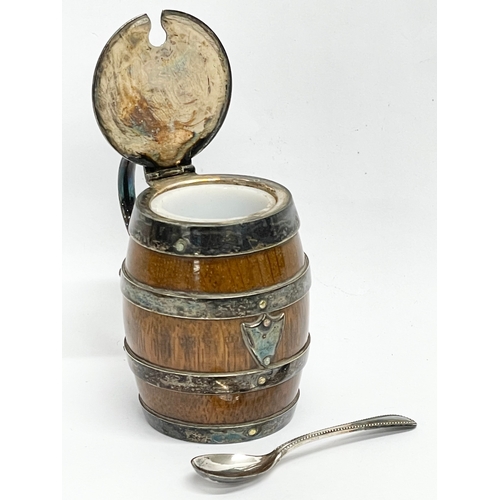 133 - A 2 piece Victorian oak and silver plated condiment set by John Grinsell & Sons. Circa 1880. 9x8cm