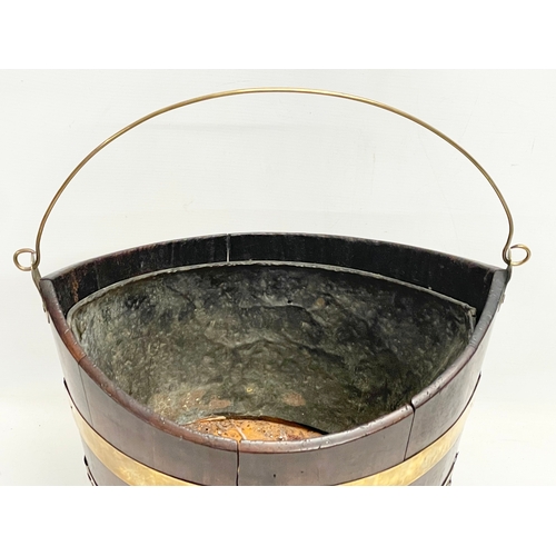 40 - A George III brass bound mahogany peat bucket with original liner. Circa 1800. 37x27x37cm