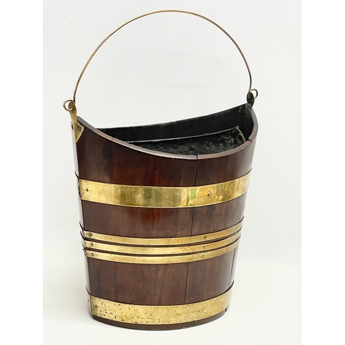 40 - A George III brass bound mahogany peat bucket with original liner. Circa 1800. 37x27x37cm