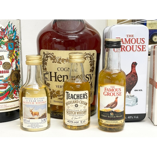 248 - A collection of alcohol. A bottle of Teachers Highland Cream Scotch Whisky Merry Christmas, 5cl. 2 H... 