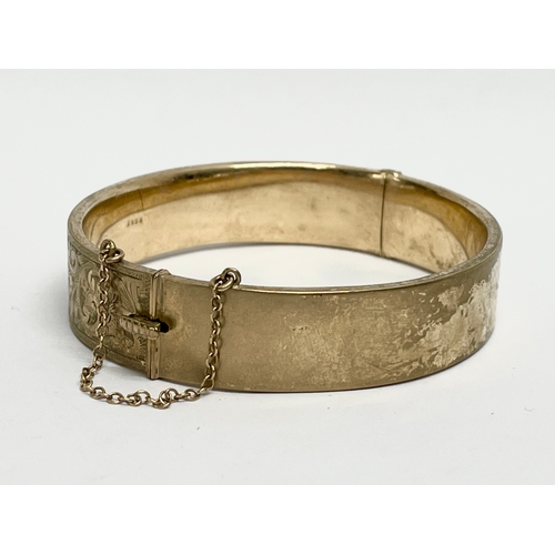 137 - A 9ct gold gold bangle. 17.69 grams.