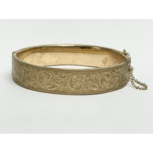 137 - A 9ct gold gold bangle. 17.69 grams.