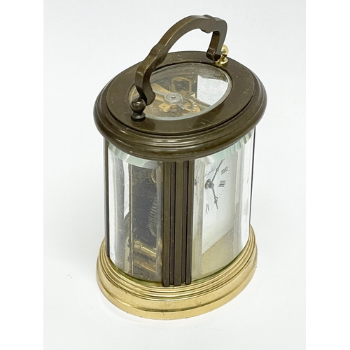 96 - A small vintage French brass carriage clock. Angelus. 7x8cm