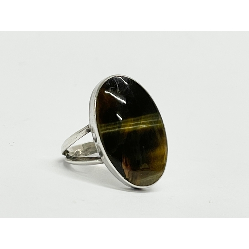 164 - A silver Tiger Eye ring.