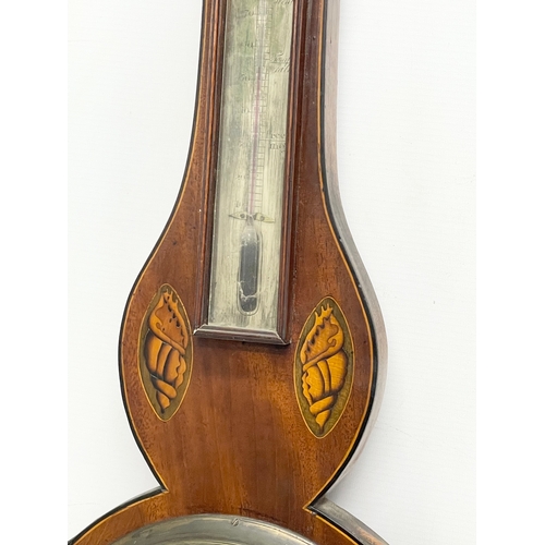 44 - A George IV inlaid mahogany barometer by J. Moretti. Circa 1820. 26x99cm.