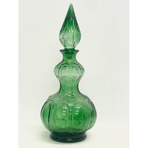 97 - A 1960’s Mid Century Italian Empoli Glass Genie decanter. 35.5cm.