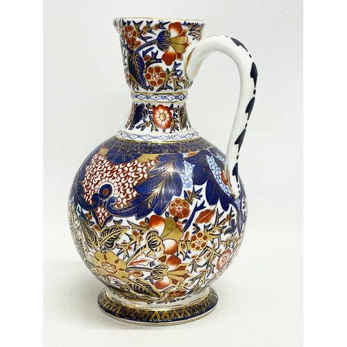 98 - A vintage ‘Imari’ pattern jug. With makers stamp. 15x22cm